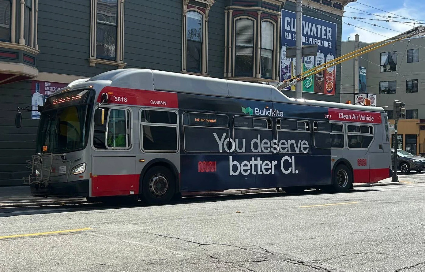 A San Francisco bus with Buildkite’s “You deserve better CI” advertisement